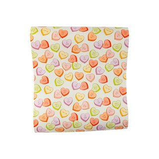 A 16" Conversation Hearts Paper Table Runner by My Mind's Eye.