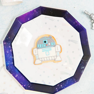 Cosmic Small PlatesReach for the stars! These plates feature foil-pressed holographic silver foil.

Illustrated by Hello!Lucky
Paper Dessert Plates
Pack of 8
Approx: 7.5"
Holographic FDaydream Society