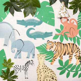 A jungle themed party with Meri Meri's Monkey Plates and green leaves, perfect for a sustainable celebration.