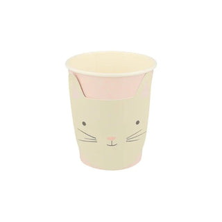 A single beige sustainable FSC paper cup designed with a cute cartoon cat face featuring whiskers, a small nose, and pointed ears on a plain background, perfect for Meri Meri Kitten Cups party decorations.
