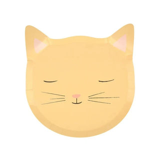 Illustration of a serene, cartoon-style cat face with closed eyes, featuring on-trend pastels in soft, pale-yellow fur color and simplistic line details for whiskers and facial features on Meri Meri's Kitten Plates.