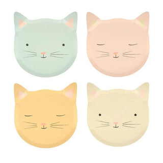 Four illustrated pastel-colored cat faces, printed on sustainable FSC paper, each displaying a serene expression with distinct hues ranging from soft blue and pink to warm yellow and cream, featuring Meri Meri Kitten Plates.