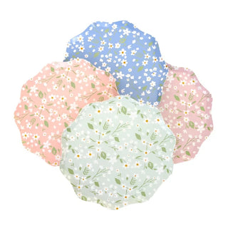 A set of four Ditsy Floral Side Plates by Meri Meri, perfect for springtime beauty.