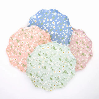 A pink plate with a floral pattern of white flowers on it.
Ditsy Floral Side Plates by Meri Meri.