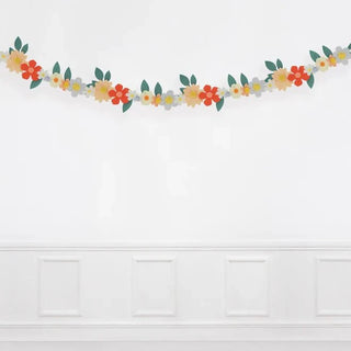Felt Flower GarlandThis fabulous felt flower garland, with pompom centers, is a stunning and sustainable way to decorate your party table, party room or to use as a home decoration. ItMeri Meri