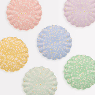 A set of Floral Reusable Bamboo Small Plates with polka dots that are dishwasher safe by Meri Meri.