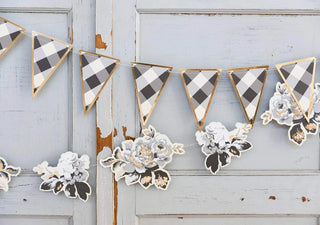 GINGHAM FARM BUFFALO CHECK PENNANT BANNERCreate a sophisticated party with our classic Buffalo Check Pennant Banner. Everyone's favorite black and cream plaid has been elevated with gold edges to create a sMy Mind’s Eye