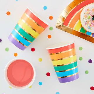 Gold Foil Rainbow Party Paper CupsPerfect for any party these rainbow paper cups will look perfect with other rainbow party decorations for a fun and vibrant setup. The vivid colours pop against the Ginger Ray