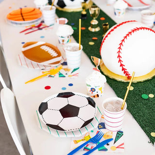 A table set up for a sports themed birthday party with Daydream Society's Good Sport Soccer Ball Plates.