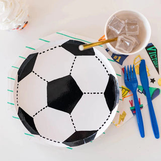 Good Sport Soccer Ball Plates by Daydream Society, with a cup and fork, perfect for team parties or birthday celebrations.