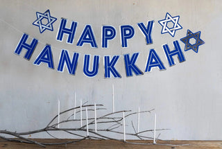HAPPY HANUKKAH BANNERWelcome friends and family to your home this Hanukkah with this "Happy Hanukkah" banner. With festive silver foil and rich blue this banner is perfect to dress up a My Mind’s Eye