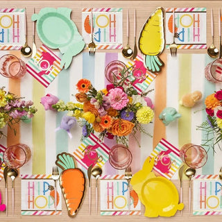 Easter table setting with colorful flowers and Sophistiplate Carrot Plate Hoppy Easter for holiday gatherings.
