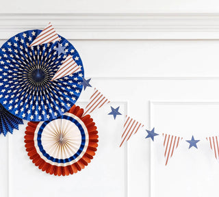 Hamptons Pennant Star BannerCelebrate in classic coastal style this summer with this pennant and star banner this summer. With ticker tape patterned pennants and blue die cut stars this banner My Mind’s Eye