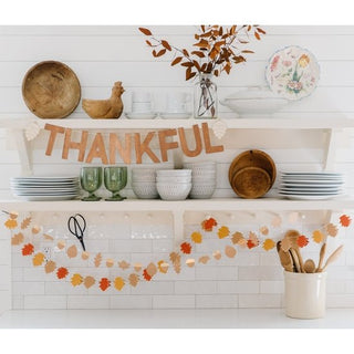 Harvest Wood Thankful Word Banner• Includes real wood letters to spell out THANKFUL and 9 feet of twine 
• letters are 5.5" x 3" in size 
• includes 2 wood pine cone shapes 
• laser etched pine coneMy Mind’s Eye