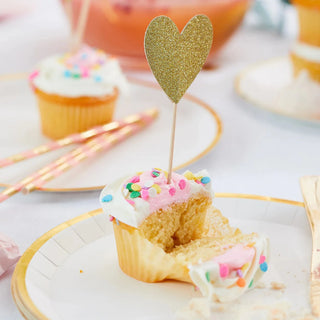 Heart Mini ToppersThese toppers are a cupcake's best friend, but they also look great skewered in apps or garnishing drinks.

Double-sided gold glitter hearts
Each heart measures apprCoterie Party Supplies