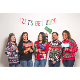 Holiday Ugly Christmas Sweater Party Decorating Kit• Make your holiday party the talk of the holiday season with the this ugly sweater party kit 
• Includes one “Let’s Get Ugly” banner, eight photo props and 4 best sPearhead
