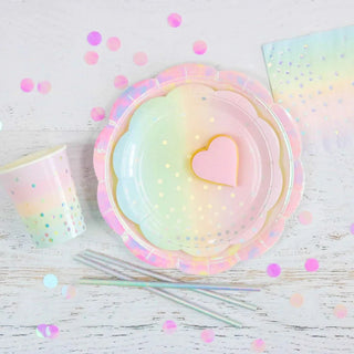 A table with high quality Illume iridescent pastel cups, napkins, and confetti for a pastel themed party.