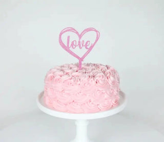 Valentine's Day cake toppers for an engagement party or wedding celebration. Personalize your Valentine's Day cake with these elegant Merrilulu Love - Heart Acrylic Cake Topper in Pink Glitter toppers.