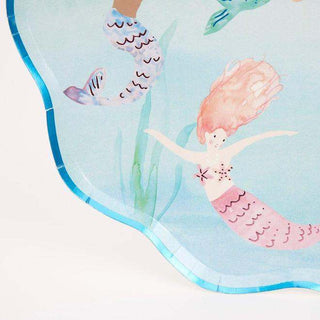 Mermaids Swimming Plates

These gorgeous shell-shaped plates will look amazing at a mermaid or under-the-sea party. They feature 6 beautiful mermaids swimming in the sea, with lots of colorMeri Meri