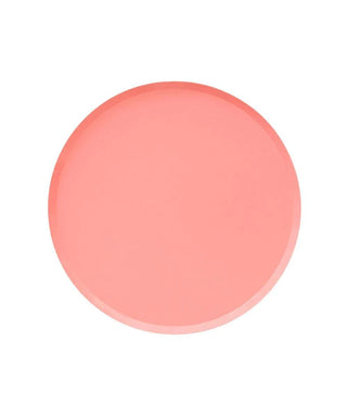 A plain, circular, Pretty in Pink Plates - 7 inch set centered against a white background, showcasing a simplistic design with a smooth texture and slightly curved edges, ideal for minimalist table settings by Oh Happy Day.