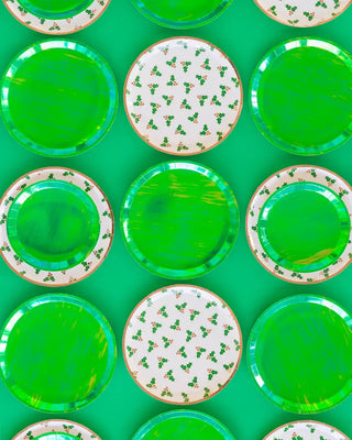 A set of Posh Emerald City Round Plates by Jollity & Co on a matching background.
