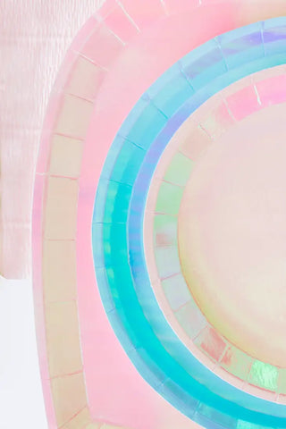 A circular object with a rainbow colored surface and foil detail would be the Posh Just Peachy Round Plates by Jollity & Co.