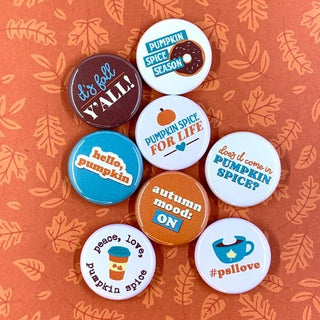 Pumpkin Spice 1-inch Pins* Set includes eight 1-inch buttons. They are about the size of an American quarter. 
* Pins come packaged in a 3- by 4-inch cello sleeve with a logo cardstock backiRuth & Dottie