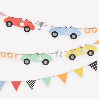Colorful vintage Race Car Garland cutouts with numbers 1, 2, 3, and 4, and a "go!" flag, strung along garland with matching triangular pennants on.