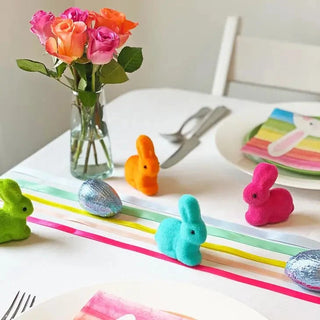 Colorful Rainbow Mini Easter Bunnies table runner by Talking Tables.