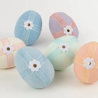 A group of colorful Meri Meri Surprise Eggs on a white surface, perfect for party decorations.