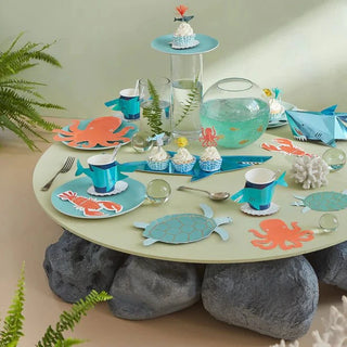 An octopus on a table at an under-the-sea party with Meri Meri Turtle Plates.