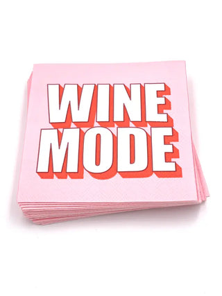 A stack of Soiree-Sisters Wine Mode COCKTAIL NAPKINS for a party tabletop.